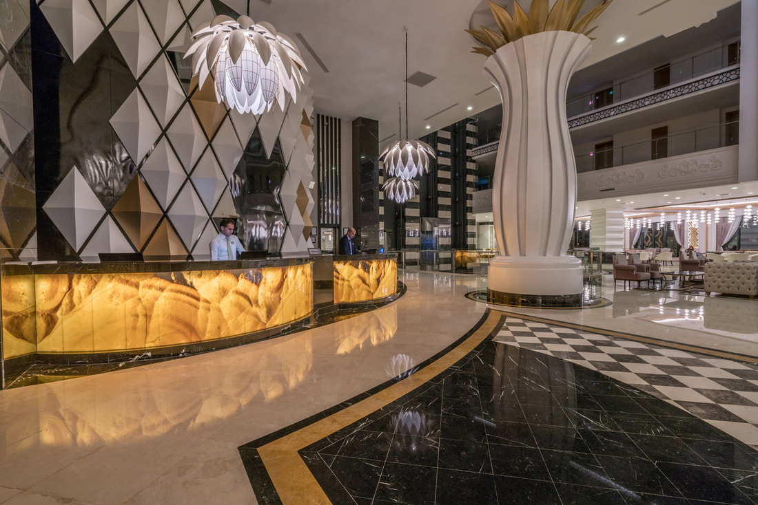 Marble and gold atrium in luxury boutique hotel.